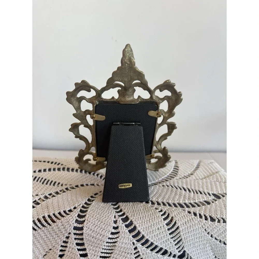 vintage brass picture frame Ornate rococo-style scrollwork Design. 2.5x3.5.